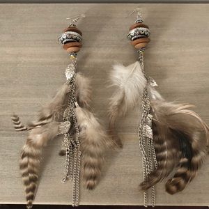 Bohemian dangling feather earrings with silver tone hardware and wood details